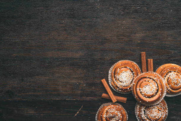 istock Traditional Swedish cinnamon bun on a wooden table 1049489364