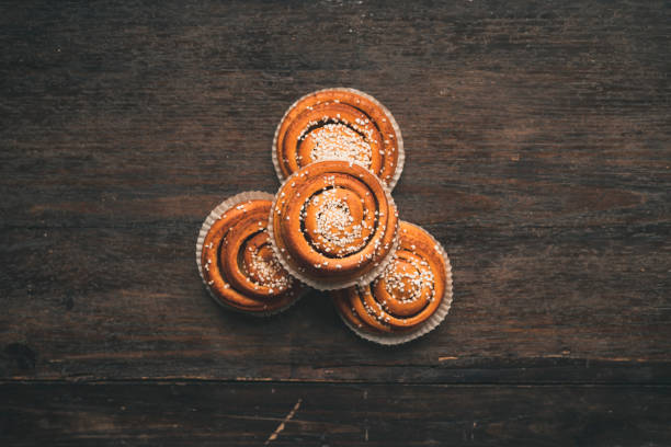 istock Traditional Swedish cinnamon bun on a wooden table 1049489392