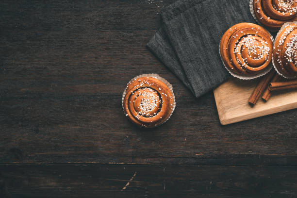 istock Traditional Swedish cinnamon bun on a wooden table 1049489404