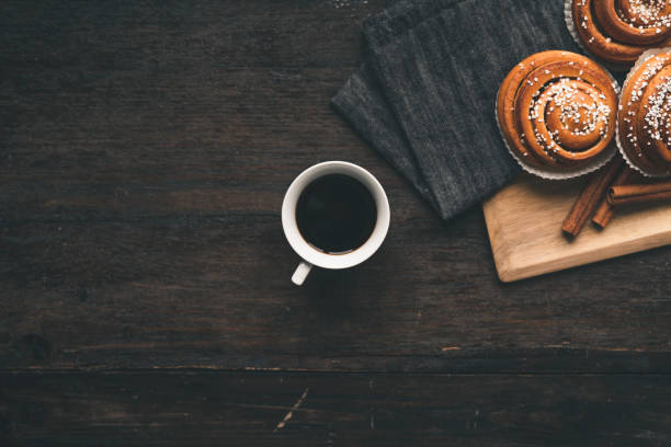 istock Traditional Swedish cinnamon bun on a wooden table 1049489416