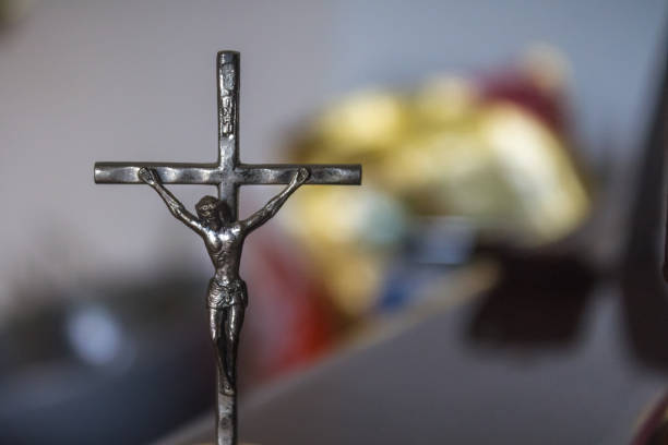 istock Small crucifix statue Christ on Cross 1049489444