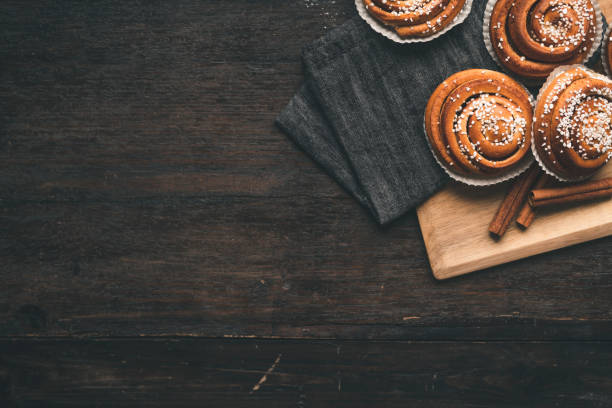istock Traditional Swedish cinnamon bun on a wooden table 1049489452