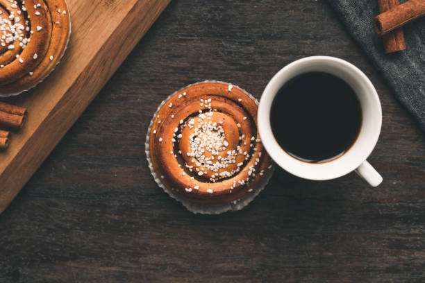 istock Traditional Swedish cinnamon bun on a wooden table 1049489530