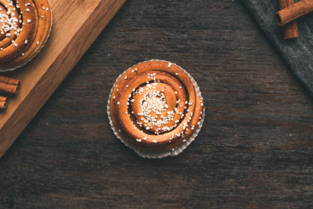 istock Traditional Swedish cinnamon bun on a wooden table 1049489542
