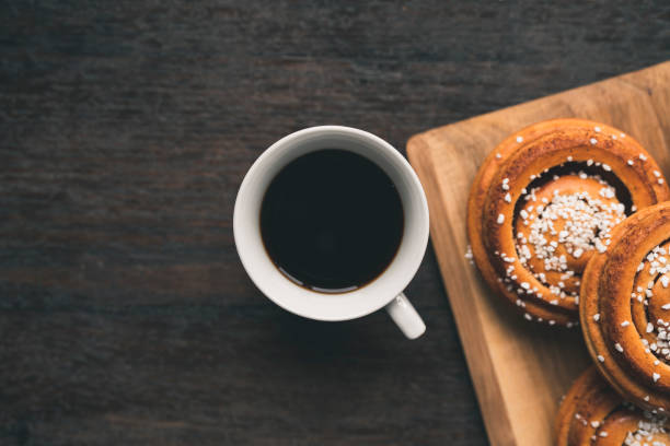 istock Traditional Swedish cinnamon bun on a wooden table 1049489628