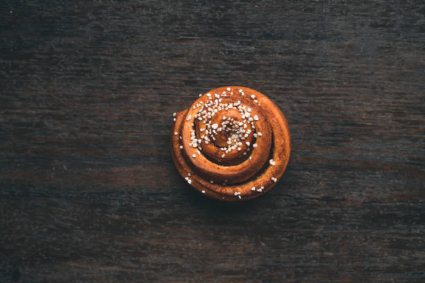 Top down view of traditional Swedish cinnamon roll. Typical dessert in Sweden, especially for Cinnamon Bun Day.