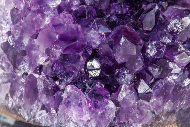 istock Amethyst Crystal Druse  macro mineral on white background 1049493272