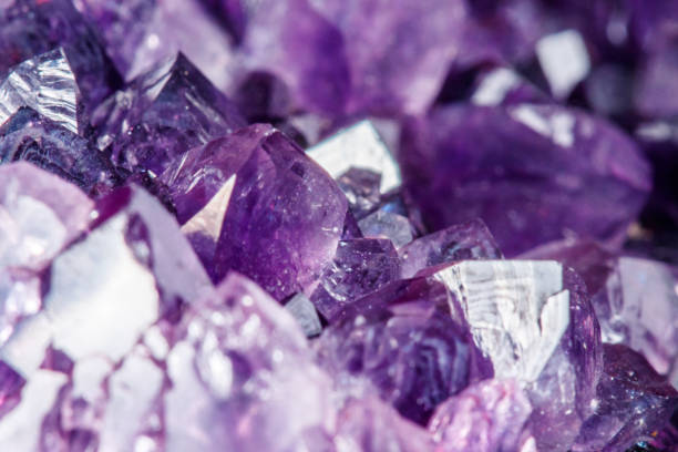 istock Amethyst Crystal Druse  macro mineral on white background 1049493410