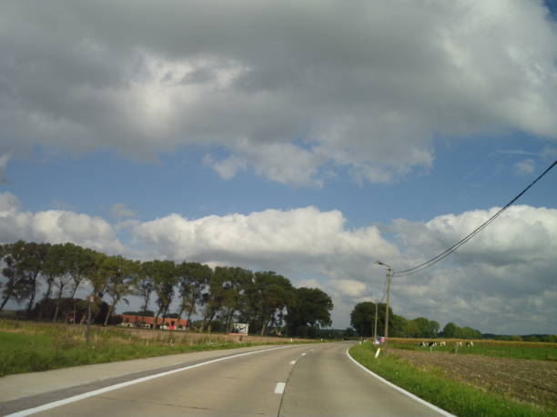 istock Superb summer country ride and cloudscape 1049497772