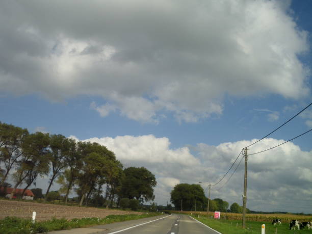 istock Windy September country ride idyllic cloudscape 1049498636