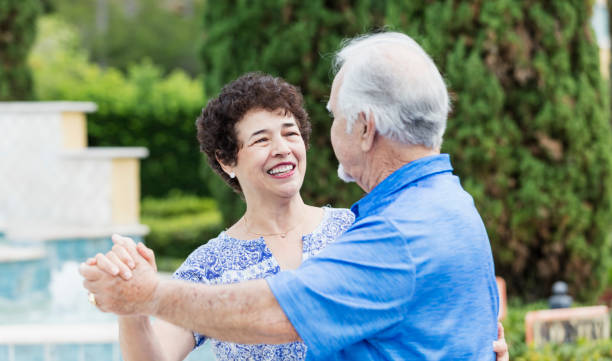 istock Senior Hispanic couple slow dancing, smiling 1049501152