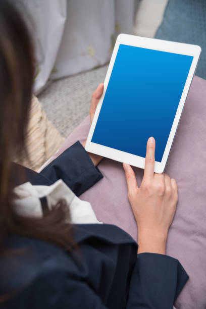 istock Businesswoman Using Digital Tablet In Office 1049501304