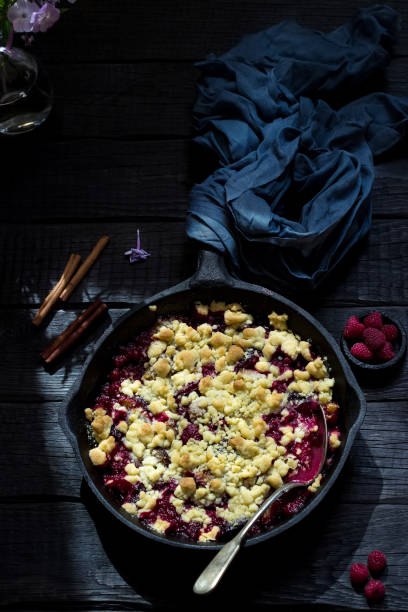 istock Crumble pie with berries on wooden background. 1049505354
