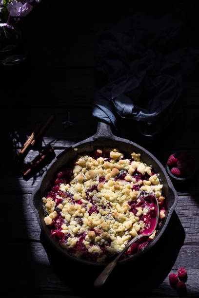 istock Crumble pie with berries on wooden background. 1049505382