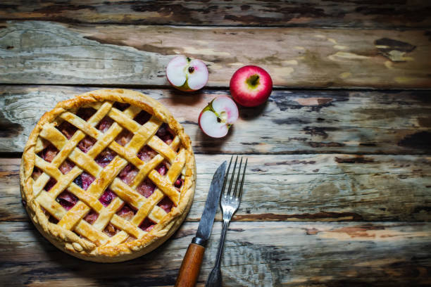 istock Homemade fruit pie on wooden table. 1049505892