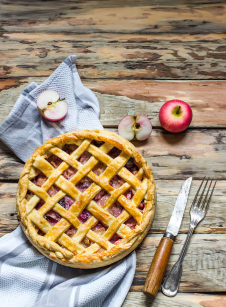 istock Homemade fruit pie on wooden table. 1049506282