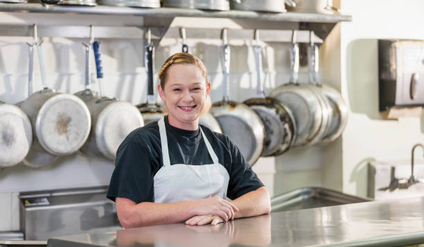 istock Woman working in commercial kitchen 1049509162