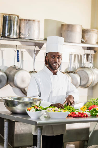 istock Chef preparing food in commercial kitchen 1049509546