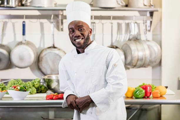 istock African-American man working as chef in restaurant 1049509848