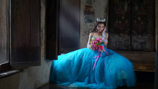 istock Beautiful Bride Wearing Blue Wedding Dress While Holding Bouquet 1049512266