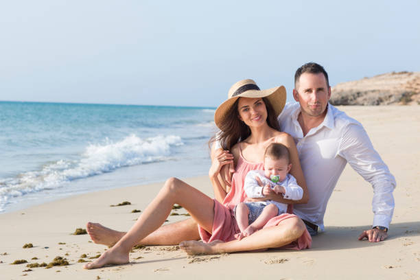 istock Good looking , young family is spending nice time at the beach. 1049512418