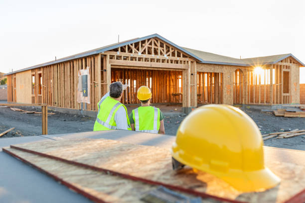 istock Male and Female Construction Workers at New Home Site 1049519916