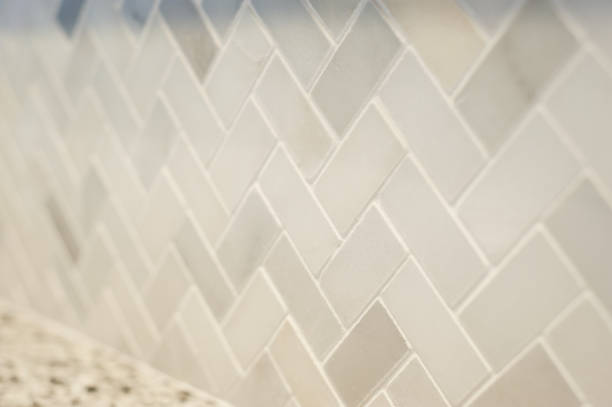 istock Detail of new herringbone tile pattern installed in a kitchen 1049527400