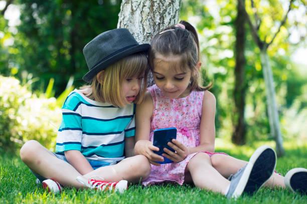 istock Shocked children looking at phone 1049543096