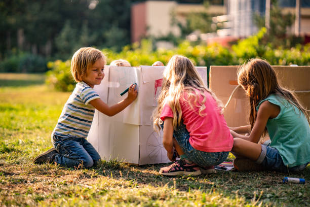 istock Children effort to make a train of cardboard boxes 1049548354