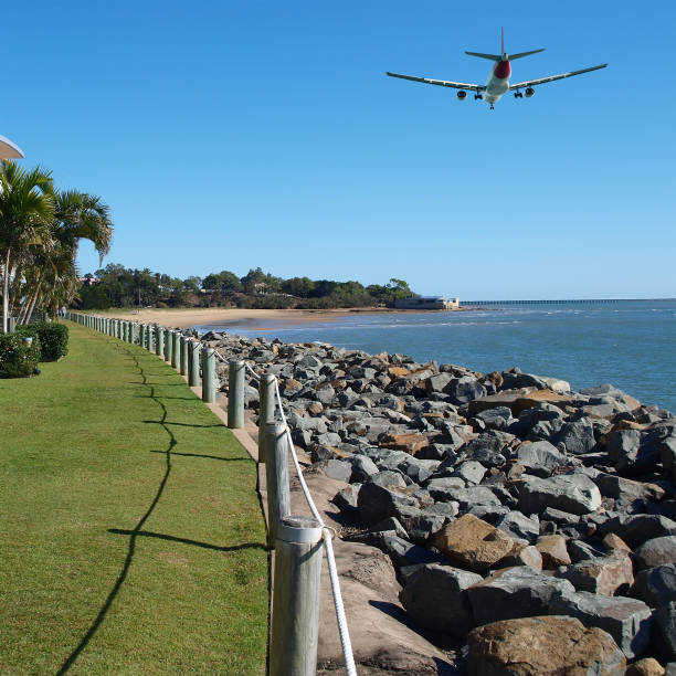 istock Jet Airliner Flying in an vibrant blue coloured tropical sky. 1049554234