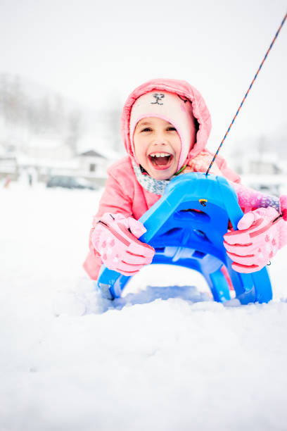 Cheerful Young Girl Having Fun on Snow.