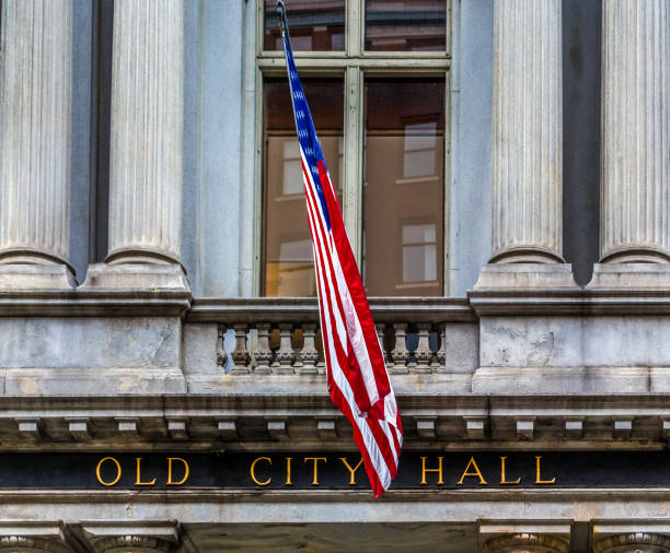 istock Old City Hall Sign with Flag 1049565436