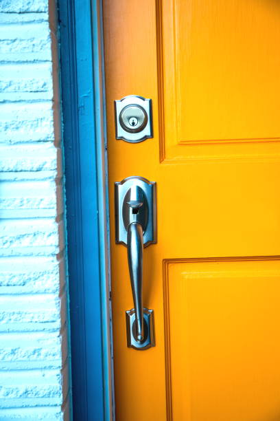 istock Door handle with a lock on wooden door 1049576266