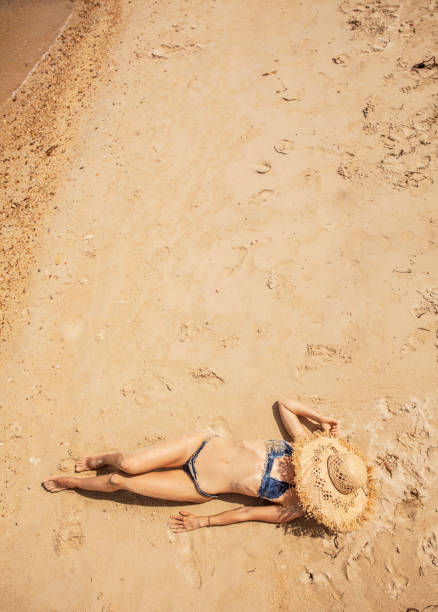 istock Woman at tropical beach 1049576562