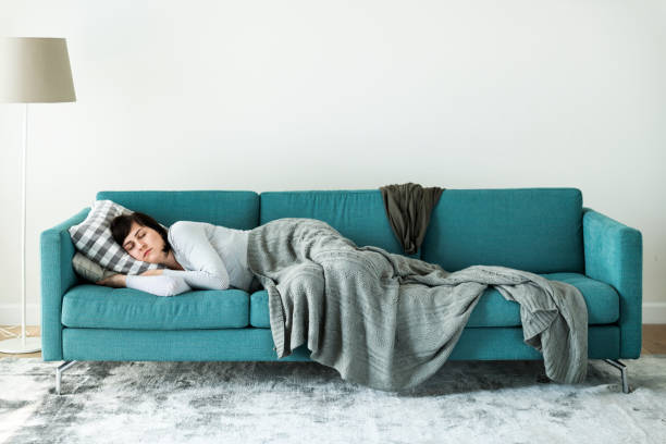 istock Woman sleeping on the sofa 1049579352