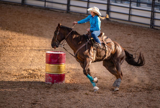 istock Young cowgirl barrel racing rodeo 1049583794