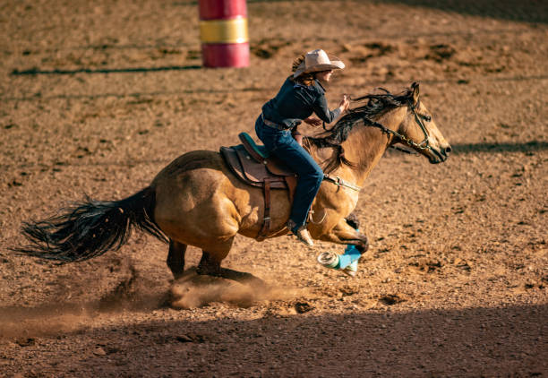 istock Young cowgirl barrel racing rodeo 1049583908