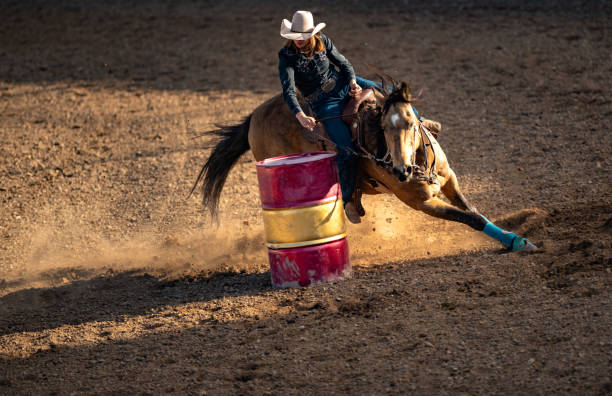istock Young cowgirl barrel racing rodeo 1049583940