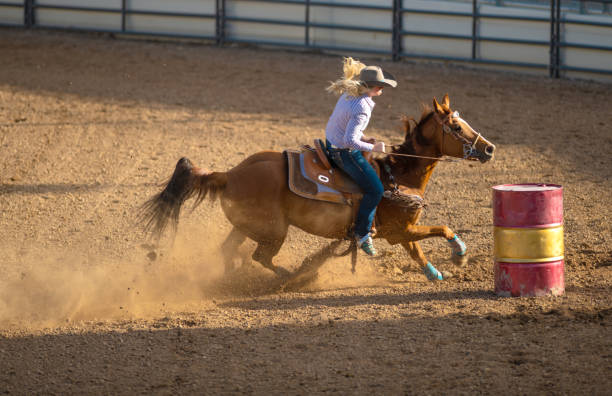 istock Young cowgirl barrel racing rodeo 1049583942