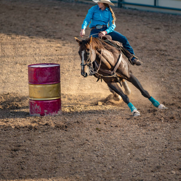 istock Young cowgirl barrel racing rodeo 1049583944