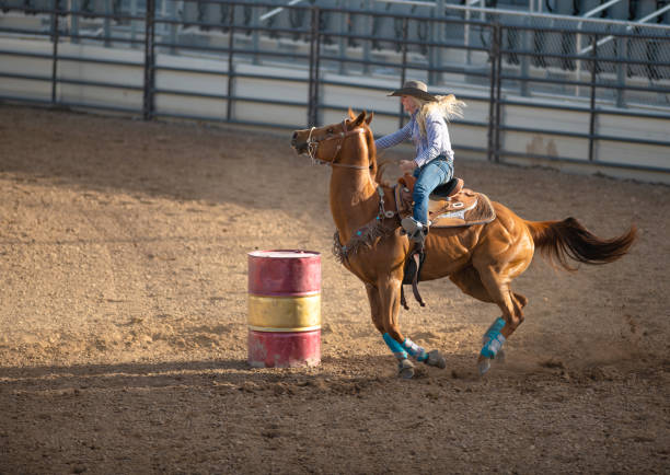 istock Young cowgirl barrel racing rodeo 1049583964