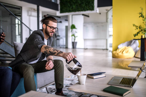 Young Businessman Taking Coffee Break