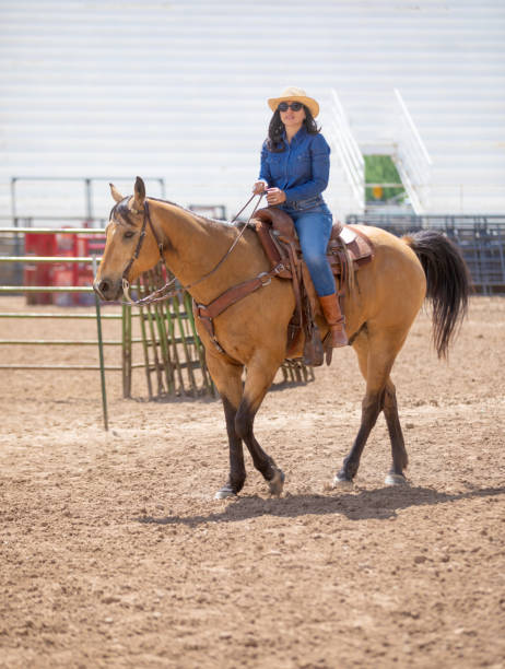 istock Woman learning how to ride a horse 1049586794