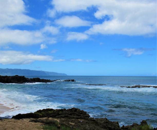 istock Three Tables beach, North Shore, Haleiwa, Oahu Hawaii  It gets its name from the three reefs off shore, a popular place to snorkel when its calm. 1049589770