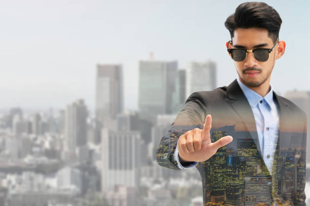 istock Double exposure businessman pointing at copy space 1049589810