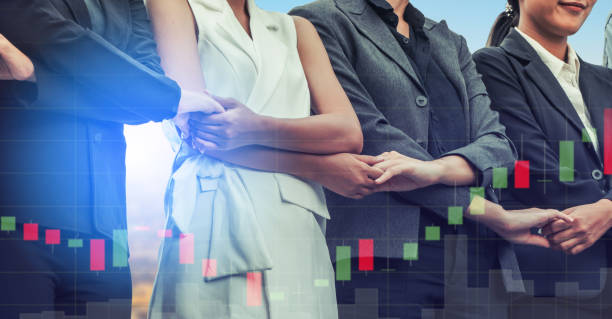 istock Double exposure business people holding hands. 1049589914