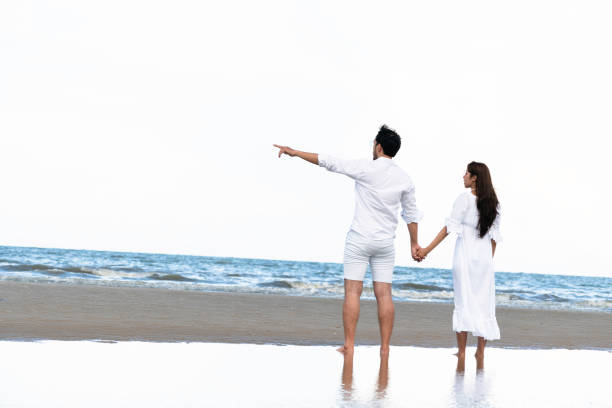 istock Couple going honeymoon on tropical beach in summer 1049595662