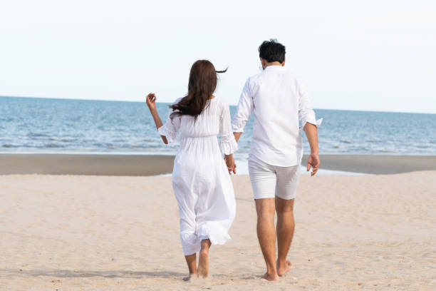 istock Couple going honeymoon on tropical beach in summer 1049595668