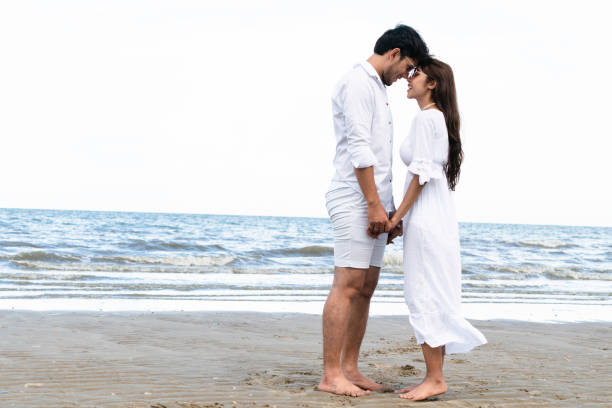 istock Couple going honeymoon on tropical beach in summer 1049595682