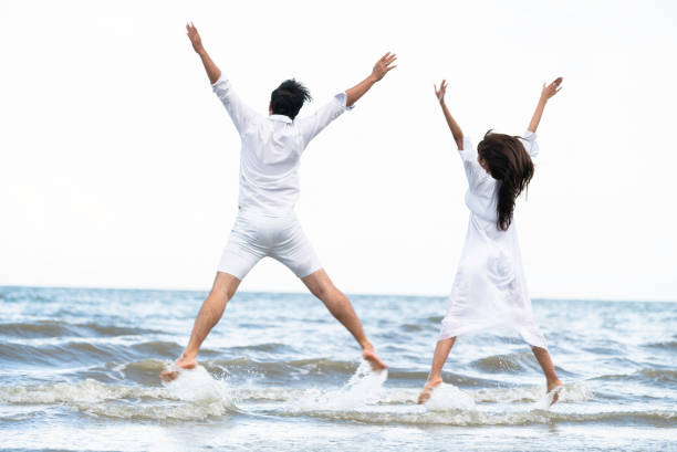 istock Couple going honeymoon on tropical beach in summer 1049595688